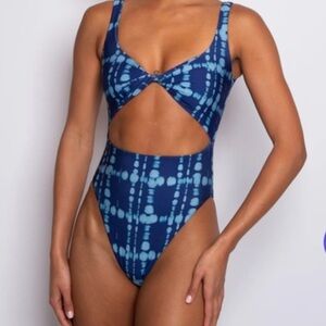 Skatie swim, never worn, size medium. Tags and protector still in place